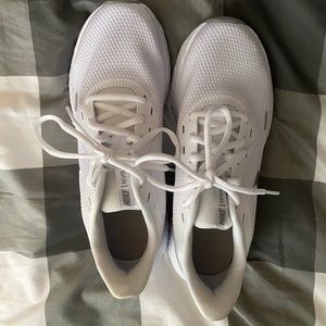 White and Silver Nike Revolution Sneakers